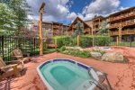 Enjoy the hot tubs and sun deck at Tenderfoot Lodge